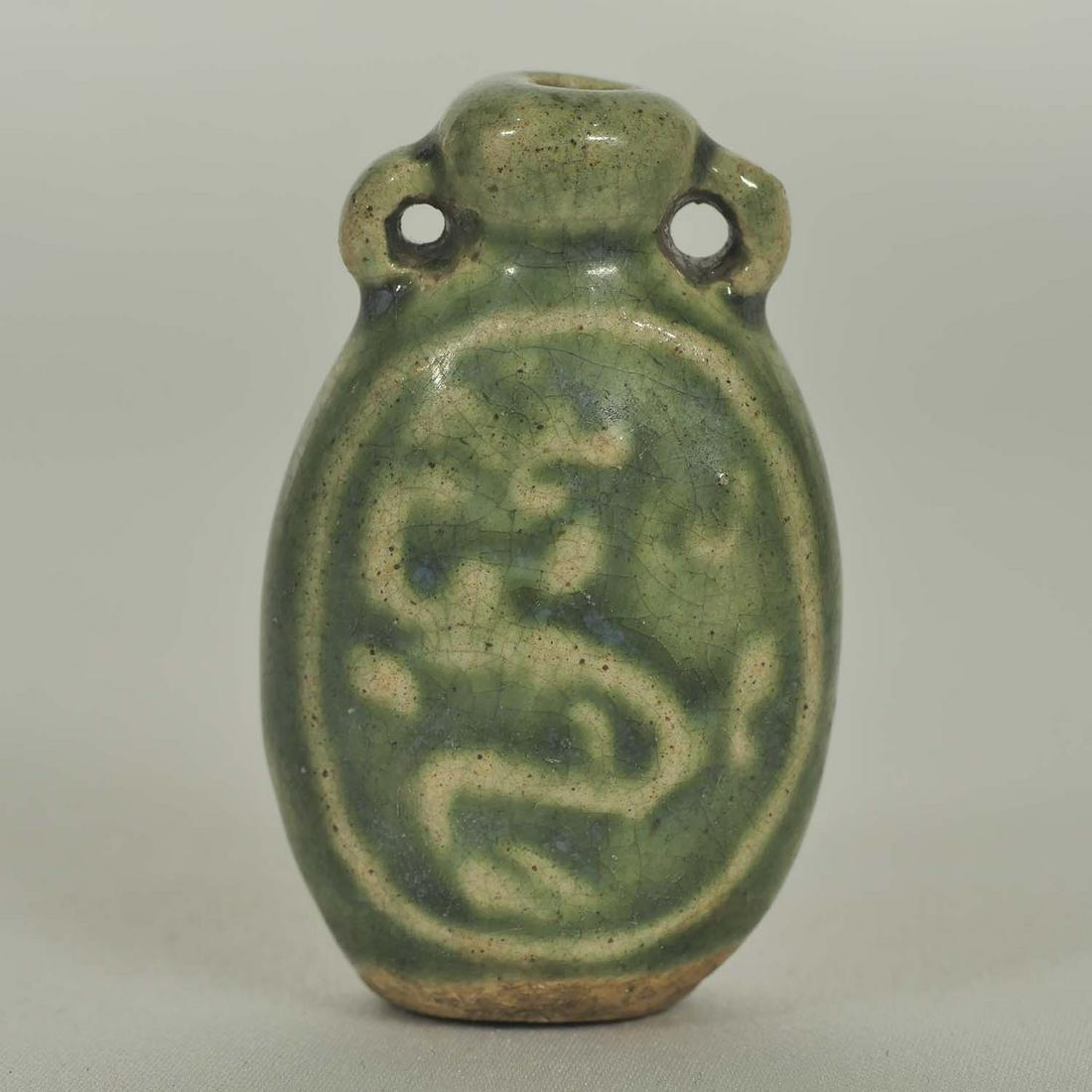 Longquan Perfume Bottle, Late Ming: Unique and rare emerald green Longquan perfume bottle with carved dragon motif. Height 47mm, 1-4/5"inch