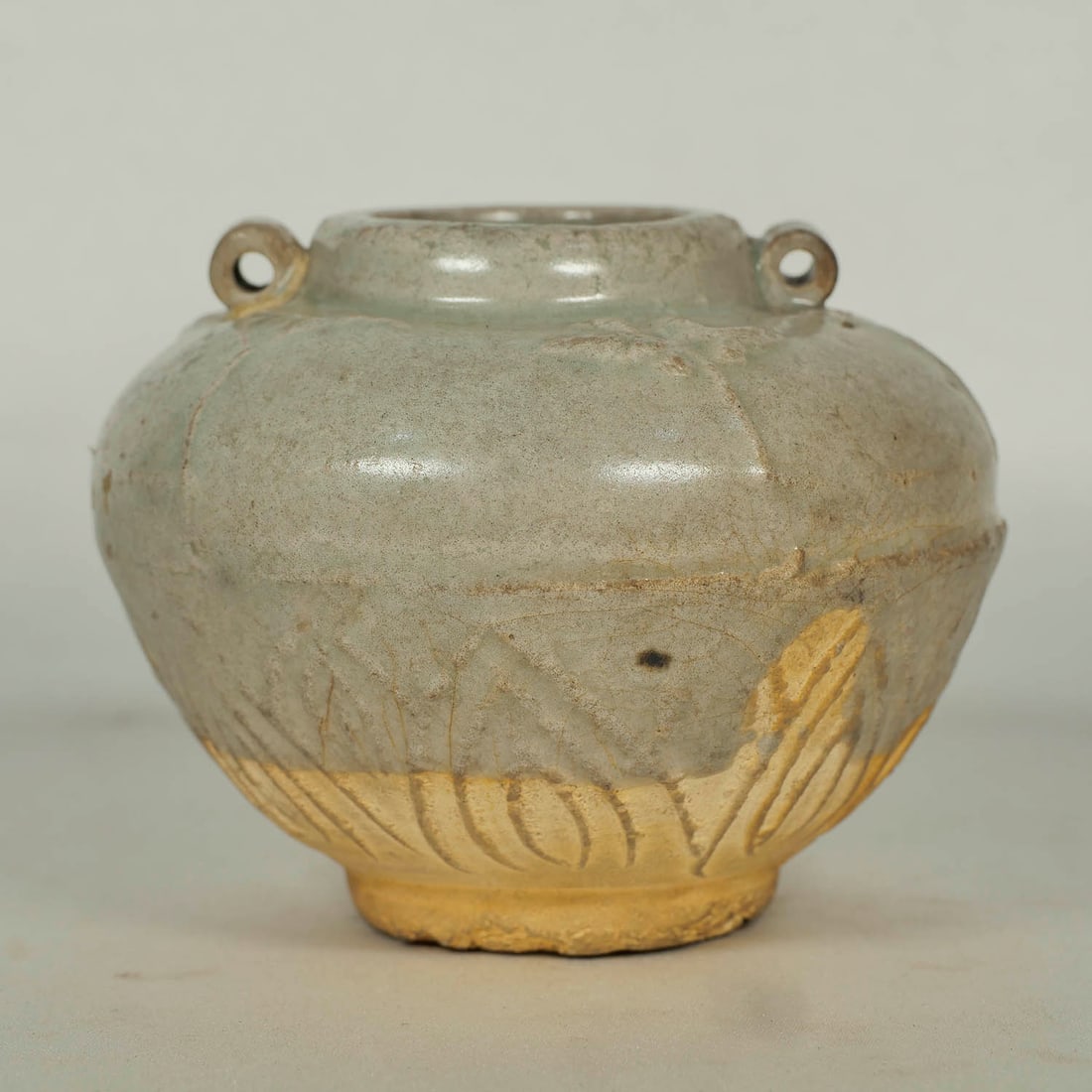 Water Pot with Molded Peony Sprout, Yuan: Gray glaze water pot with molded peony sprout motif and two lugs. Diameter 87mm, 3-2/5"inch