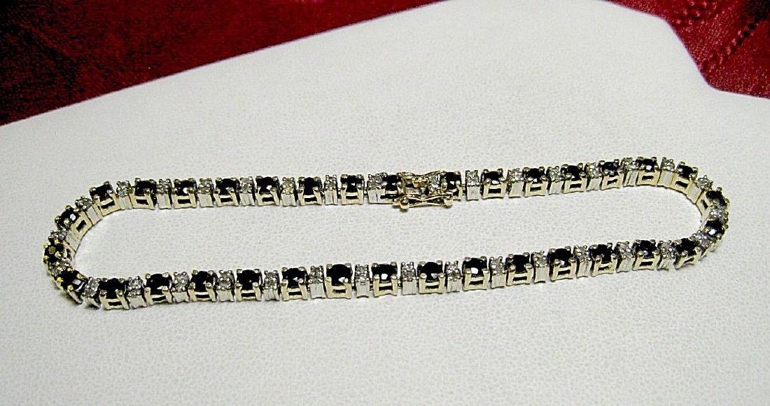 14K YELLOW GOLD SAPPHIRE & DOUBLE SET DIAMONDS TENNIS: UP FOR SALE THIS BEAUTIFUL TENNIS BRACELET THERE ARE TOTAL OF 34 ROUND CUT SAPPHIRES TOTALING APPROX 2.40 CTW, AND 64 SMALL DIAMONDS SET IN TWO IN EACH LINK IT IS 7.75" LONG AND 2.6MM WIDE TOTAL WEIGH