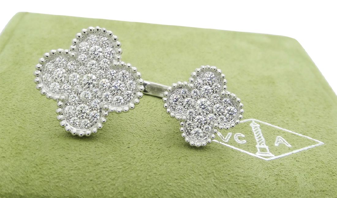 Van Cleef & Arpels Diamonds Alhambra Between the Finger: 18k white gold ring set with Diamonds.Crafted by Van Cleef & Arpels for the Magic Alhambra collection, the ring is a size 5.5, clovers measure 15 mm x 15 mm and 20 mm x 20 mm.The weight of the ring is