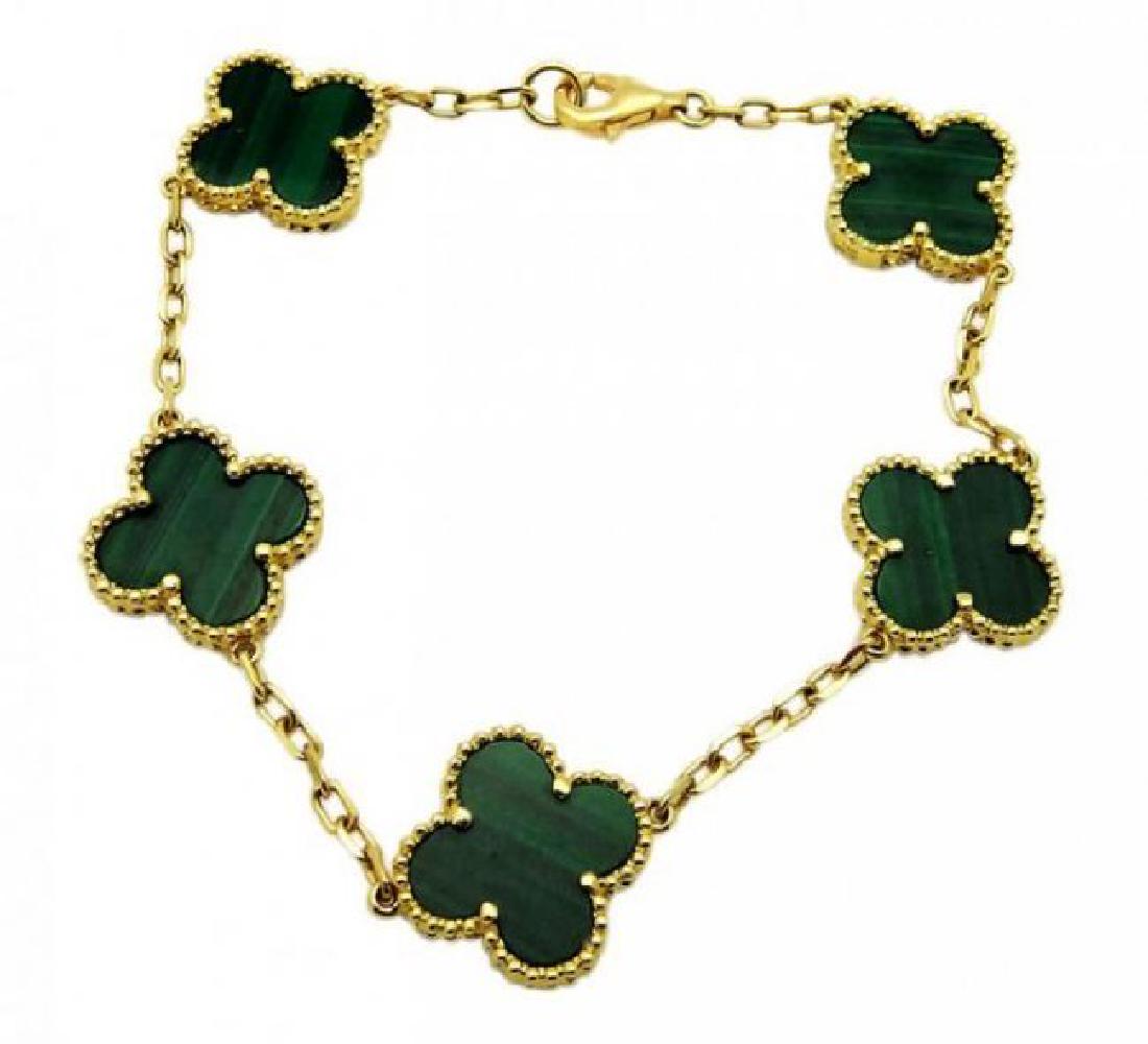 Van Cleef Vintage Alhambra Gold Malachite Bracelet: Van Cleaf & Arpels Vintage Alhambra Yellow Gold Malachite Bracelet Length: 7 inches, the weight is 10.4 g. Motif's measurements 14.5 mm