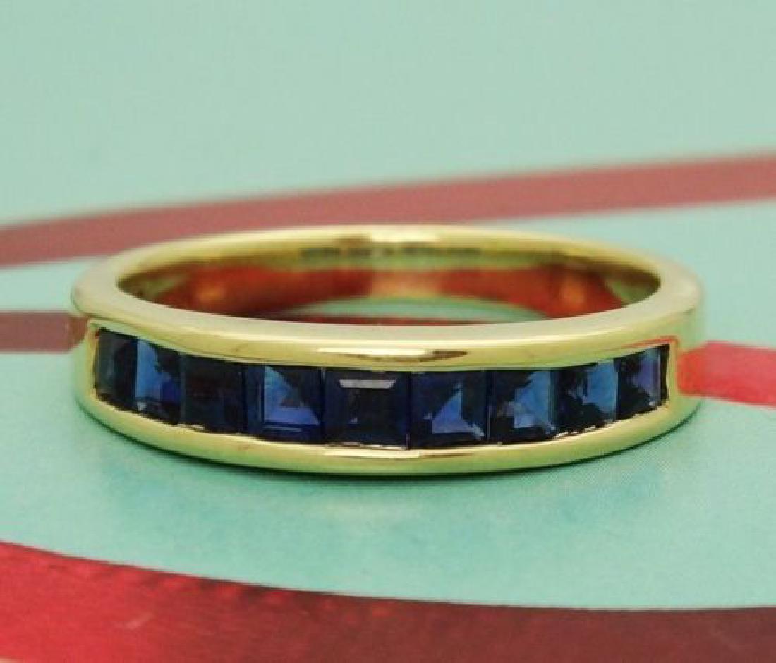 Tiffany & Co 18k Yellow Gold Sapphire Band Size 6.5: Tiffany & Co 18k Yellow Gold Sapphire Band Size 6.5 Precious Metal Type:750 18k Yellow Gold Stones: Sapphire Size: 6.5 width: 3.75mm Front Design: 17.09mm Item Weight: 4.0 grams