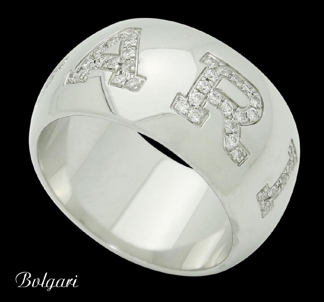 Bvlgari Bulgari 18k Gold & 0.38 Diamond Band Ring: Bvlgari Bulgari 18k White Gold & 0.38 TCW Diamond Band Ring Brand:Bvlgari Metal: 18k White Gold Stones & Gems:90 Diamonds, 0.38 TCW Total Item Weight:12.2 grams Size:5.25 Measurements: 10mm wide