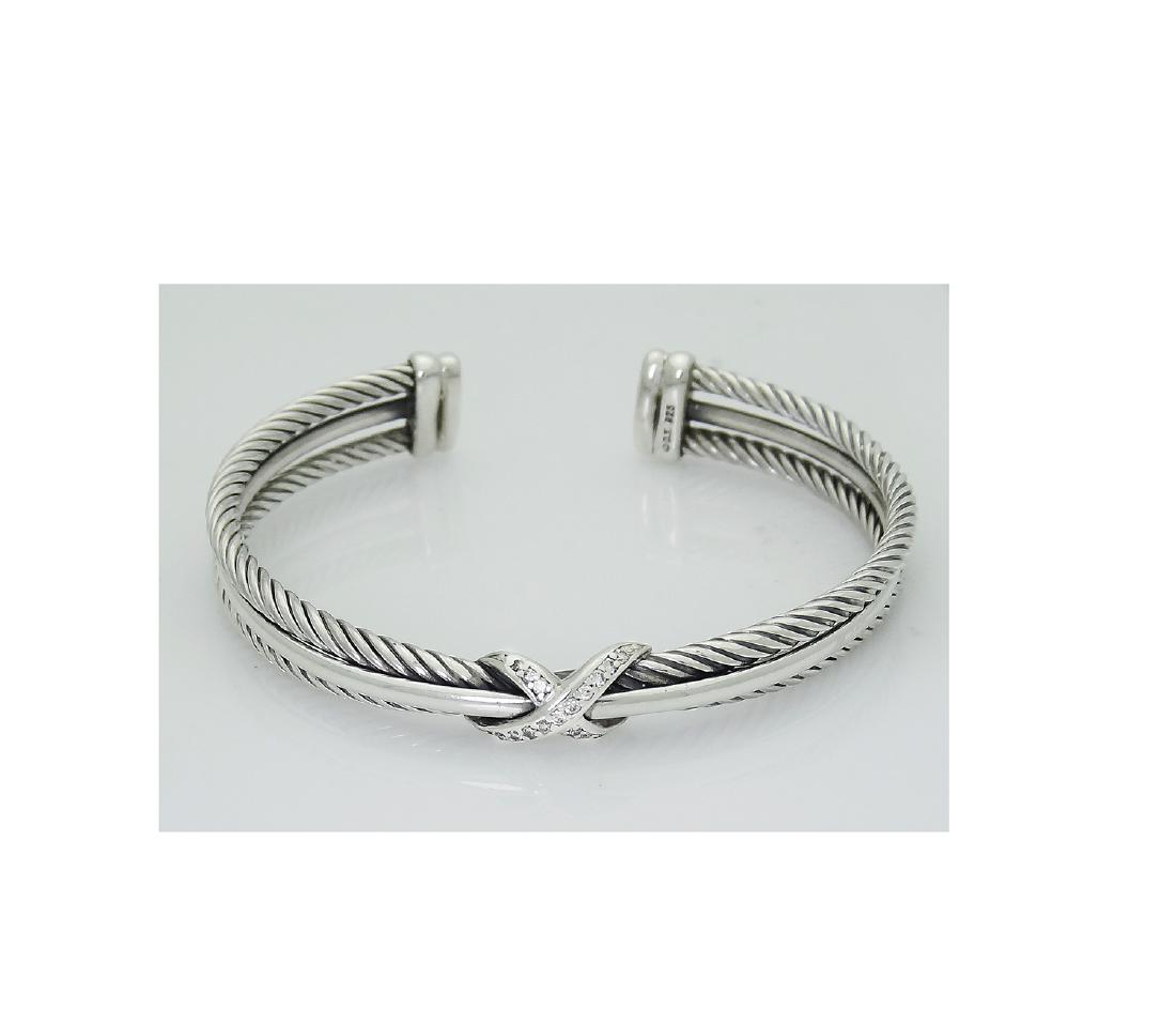 David Yurman 925 Sterling Silver Crossover X Bracelet: David Yurman 925 Sterling Silver Crossover X Bracelet with Diamonds, 7mm Retail Price: $875 Brand: David Yurman · Material:Sterling silver · Stones: Pavé diamonds, 0.13 total carat weight Width: 7m