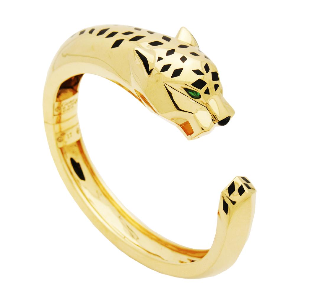Cartier 18k Yellow Gold Panthere de Cartier Cuff: Cartier 18k Yellow Gold Panthere de Cartier Cuff Bracelet Retail: $35,300.00 Metal: 18K Yellow Gold Stones: Tsavorite, Garnet,Onyx and Black Lacquer Weight: 84 g Size: 6.5" Condition: pre-owned, very