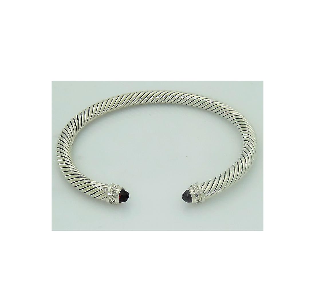 David Yurman 925 Sterling Silver Cable 5mm Classics: David Yurman 925 Sterling Silver Cable 5mm Classics Bracelet with Ruby and 0.07tcw Diamonds Retail Price: $625 Brand: David Yurman Material: 925 Sterling Silver Stones: Ruby, 0.07tcw pave diamonds Wid