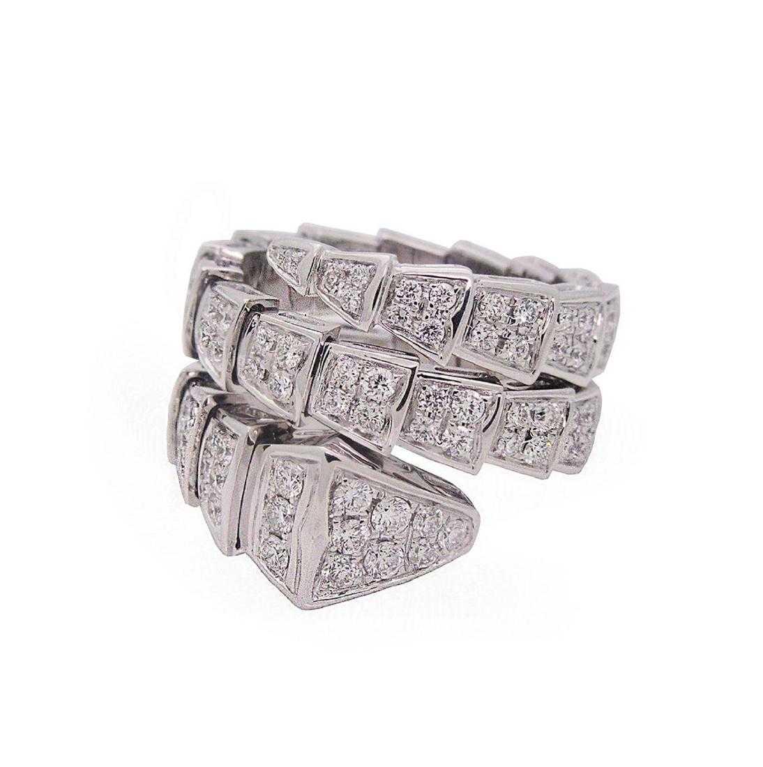 BVLGARI SERPENTI 18kt Gold Diamond Snake Ring: BVLGARI SERPENTI 18kt Gold Diamond Snake Ring Retail Price : $ 31300.00 Brand: BVLGARI Metal: 18 kt White Gold Stones : Diamonds Weight: 16 g Measurement of the Ring : 10mm/18.5mm Size : 7.75 Conditio