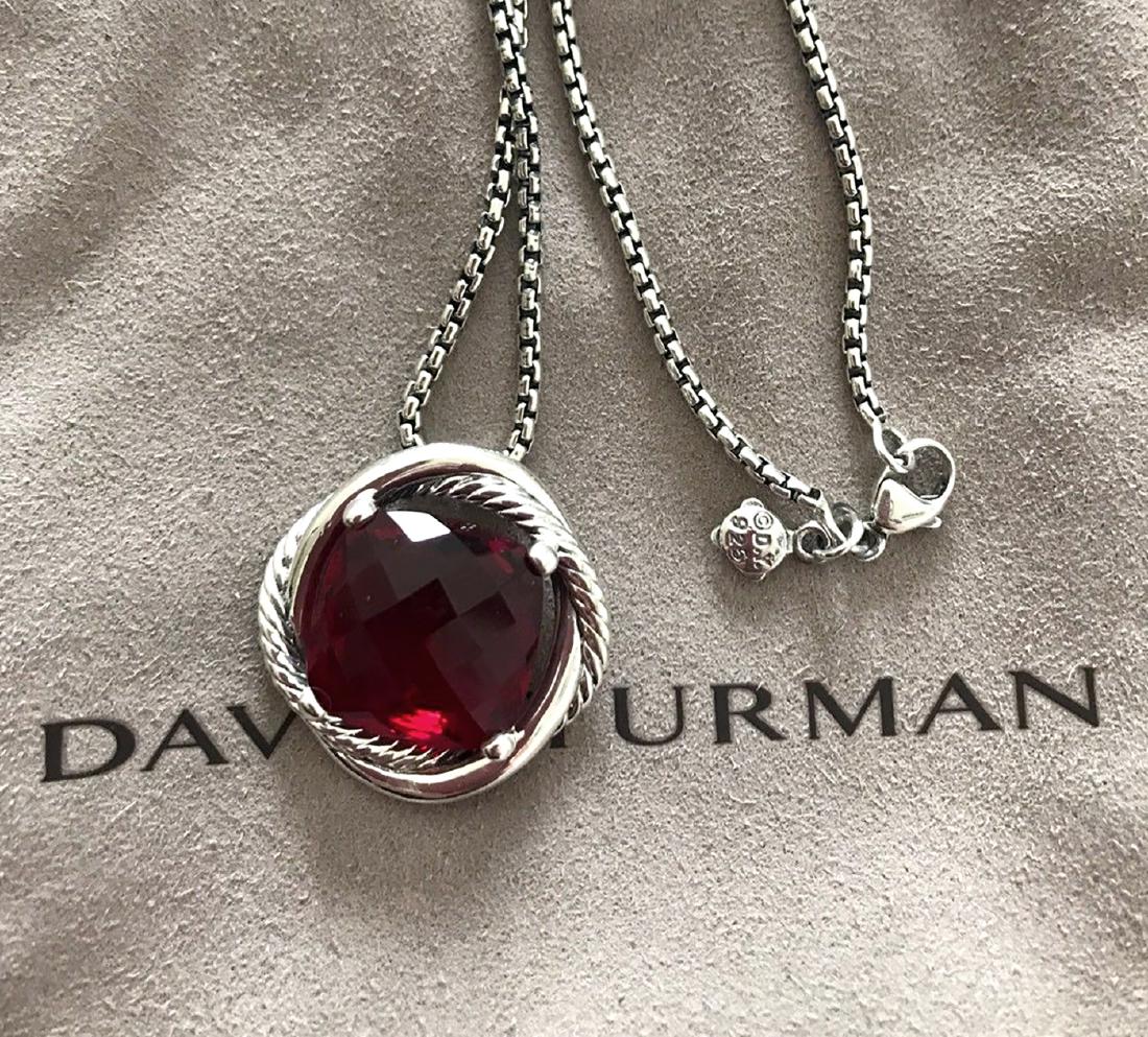 David Yurman Sterling Silver Infinity 14mm Garnet: David Yurman Sterling Silver Infinity 14mm Garnet Necklace 18” .Retail price: $695 .Metal: Sterling Silver .Stone: Faceted Garnet 14mm. .Chain Length: 18” .Condition: Like new .Comes with DY pouch
