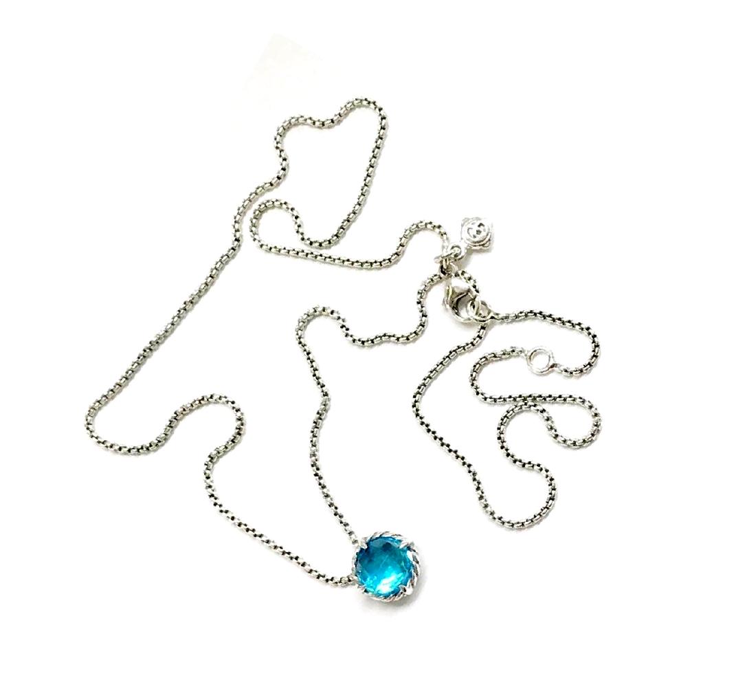 David Yurman Sterling Silver Chatelaine Blue Topaz: David Yurman Sterling Silver Chatelaine Blue Topaz Necklace .Retail price: $525 .Metal: Sterling Silver .Stone: Faceted Blue Topaz 8mm .Chain length: 16”-17” .Condition: Like new .Comes with DY po