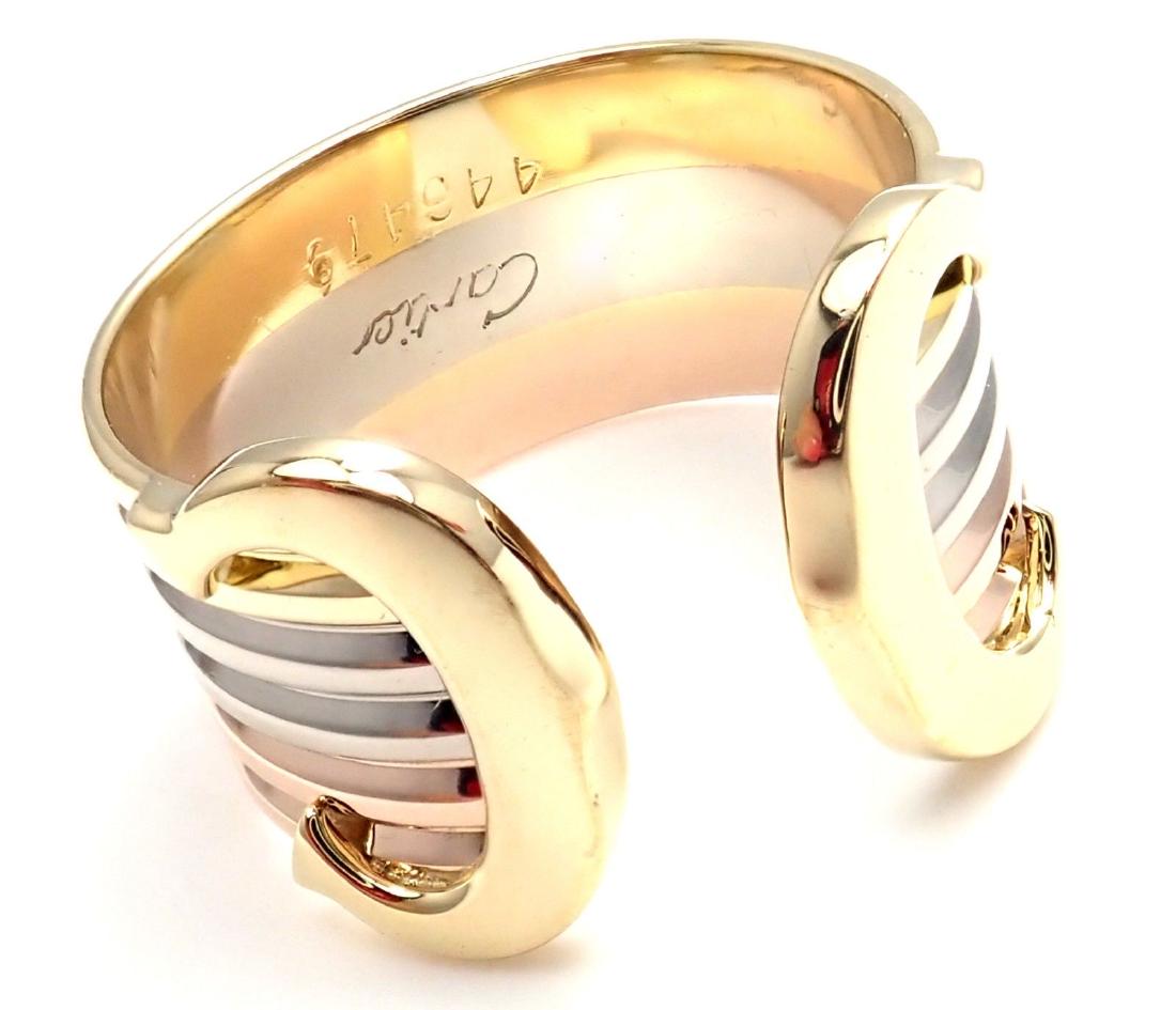 Cartier double C 18k Tri Color Gold Band Ring: Cartier double C 18k Tri Color Gold Band Ring Size 53 Metal: 18k Tri-Color Gold Size: European 53 - (US = 6 1/4) Width: 12mm Weight: 6.1 grams : mint condition Hallmarks: Cartier, 750,446479, 53