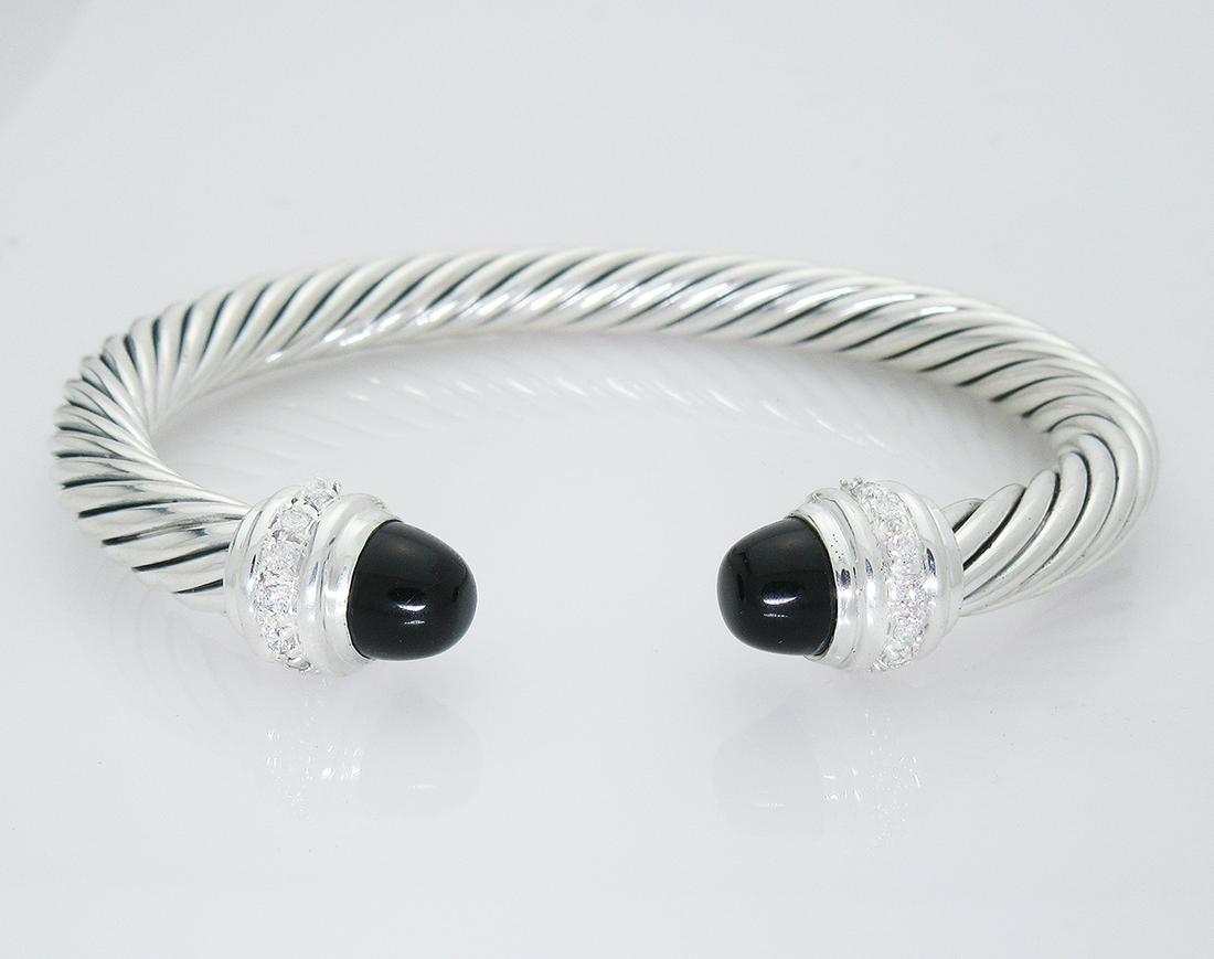 David Yurman Sterling Diamond Cabochon Onyx 7mm: David Yurman Sterling Silver Diamond Cabochon Black Onyx 7mm Cuff Bracelet -Retail price: $1600-Metal: Sterling Silver -Diamond: 0.48tcw-Gemstone: Cabochon Black Onyx-Cable width: 7 mm-Size: Medium -E