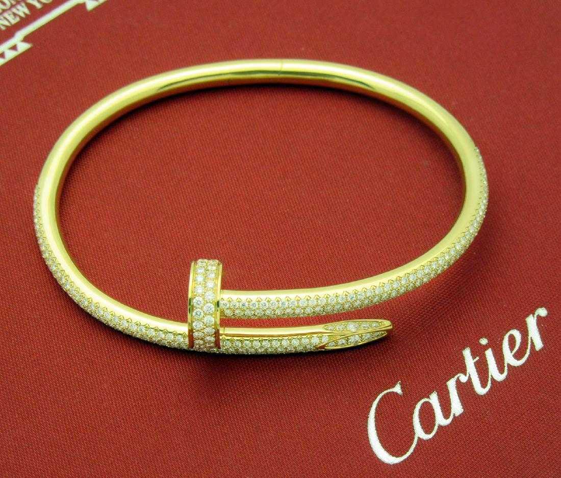 CARTIER JUSTE UN CLOU YELLOW GOLD AND DIAMONDS BRACELET: CARTIER JUSTE UN CLOU YELLOW GOLD AND DIAMONDS BRACELET Retail price: $43 500 Metal: 18k Yellow Gold Diamond: 374 Round Cut Diamonds, totaling 2.26Ct Size: 16 Condition: Pre-owned, very good. Comes as