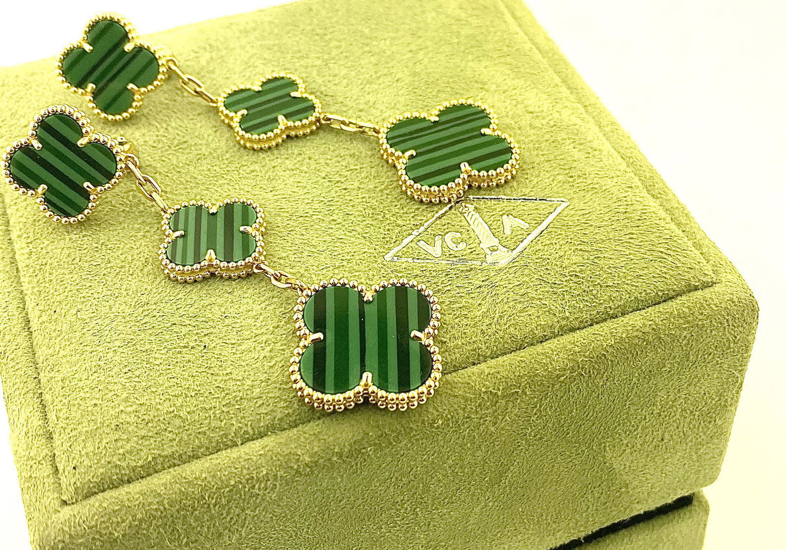 Van Cleef & Arpels 18k Magic Alhambra Malachite Earring: Van Cleef & Arpels 18k Yellow Gold Magic Alhambra Malachite EarringsBrand: Van Cleef & Arpels Collection: Magic Alhambra Stones: 6 Malachite Stones Measurements: The three motifs measure approx. 14.5m