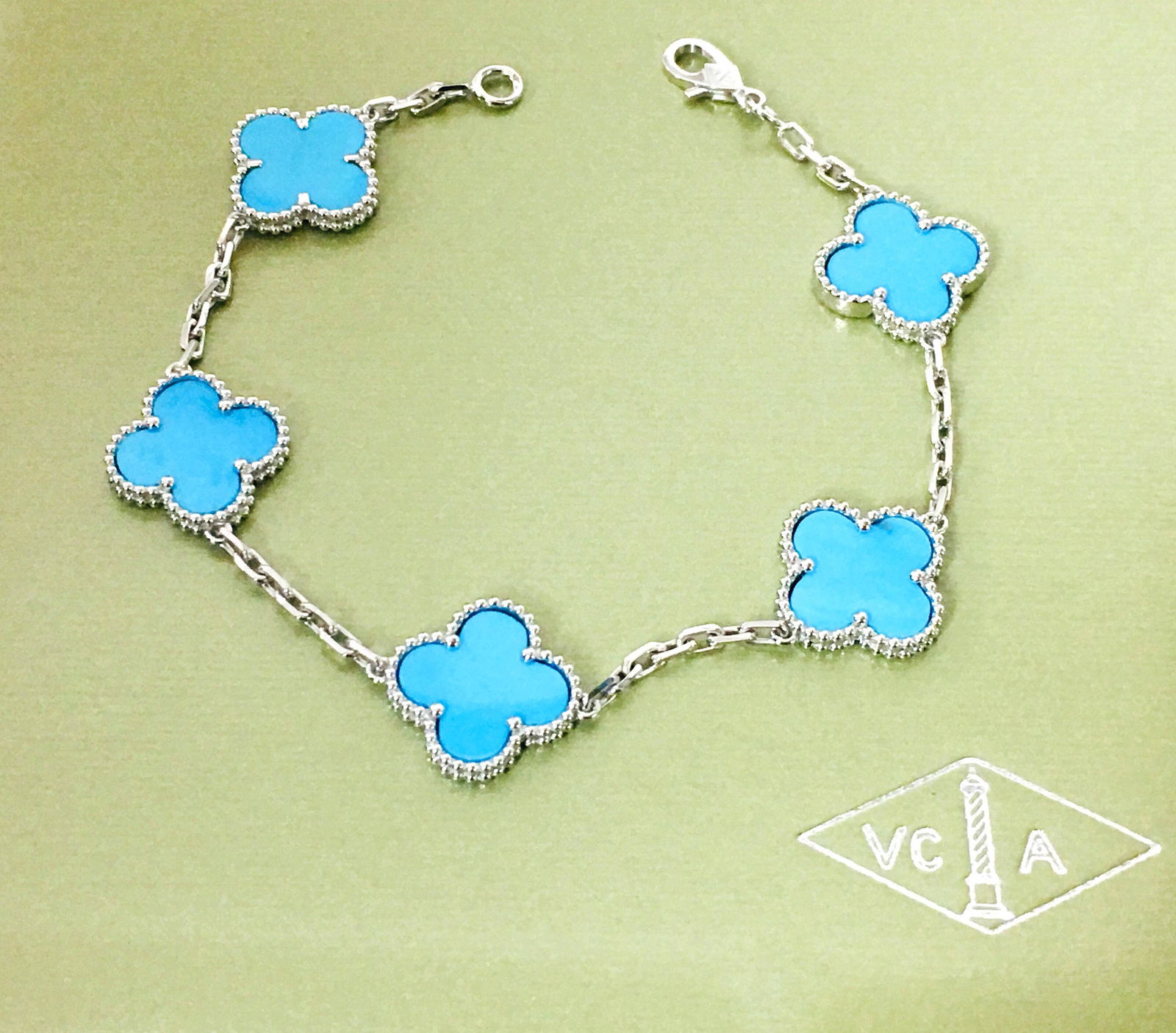 VAN CLEEF & ARPELS 18K VINTAGE ALHAMBRA TURQUOISE BRACE: VAN CLEEF & ARPELS 18K WHITE GOLD VINTAGE ALHAMBRA TURQUOISE BRACELETBRAND: VAN CLEEF & ARPELS COLLECTION: VINTAGE ALHAMBRA STONES: 5 MOTIFS TURQUOISE SIZE 7.25" CONDITION: EXCELLENT LIKE NEW!
