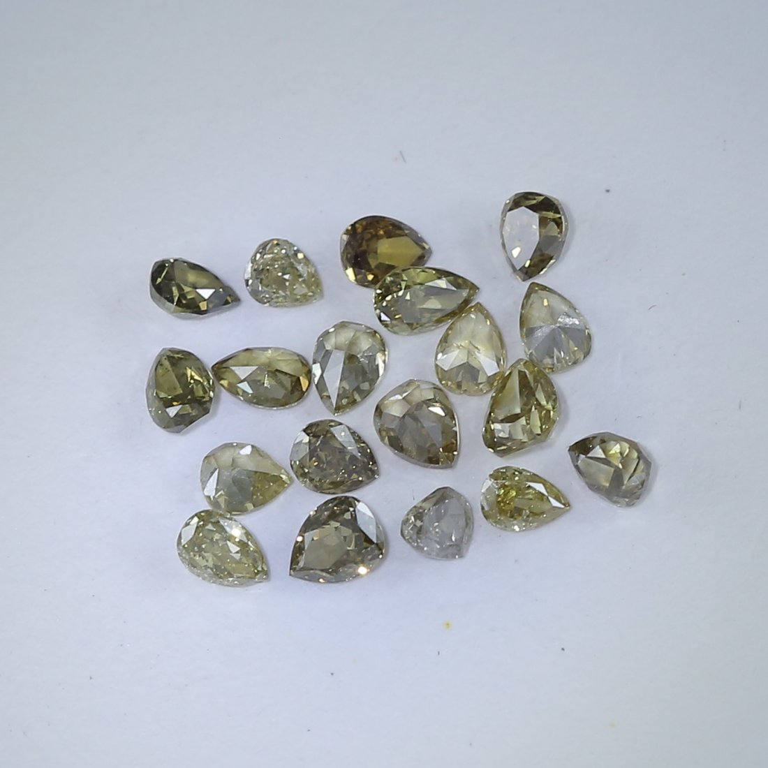 2.08 ct. Pear Brilliant Diamond Lot Untreated AUSTRALIA: 2.08 ct. Diamond Lot Untreated AUSTRALIA Cut - Pear Brilliant cut Color - Mix Color (Yellow, Brown, Green, Orange) Clarity - VS - SI Ct. Weight - 2.08 ct. Dimensions - Average Size: 10 po
