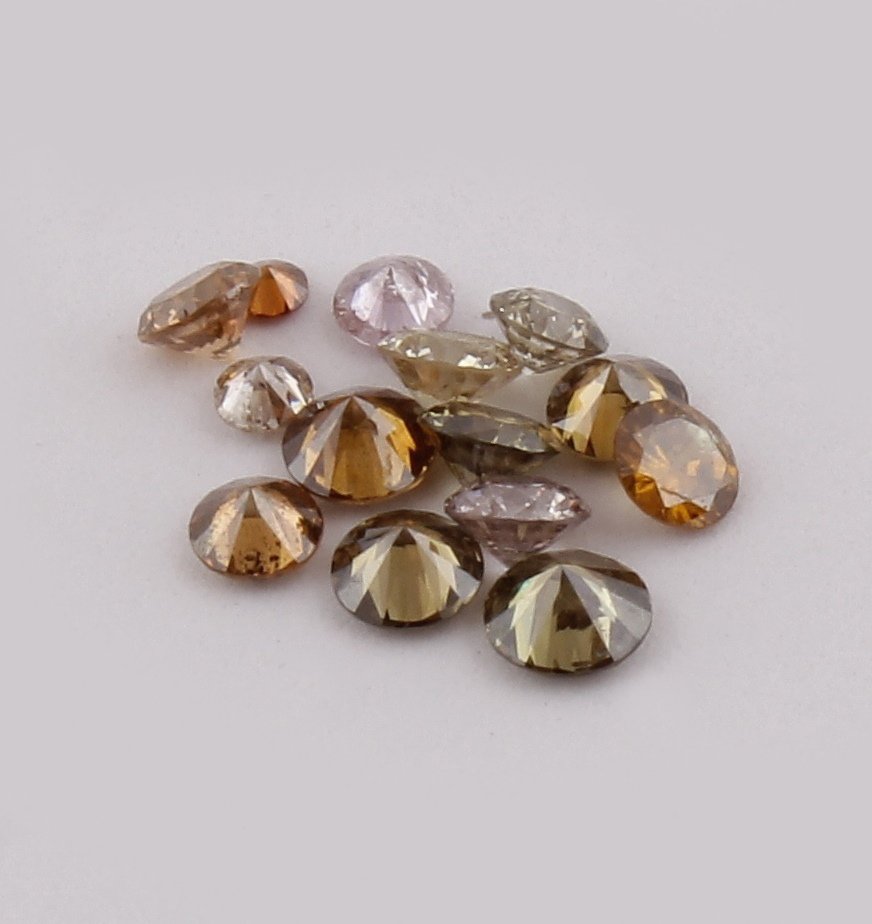 0.69 ct. Mix Diamond Lot Untreated - AUSTRALIA: 0.69 ct. Mix Diamond Lot Untreated - AUSTRALIA Cut - Round Brilliant Color - Mix Color (Yellow, Brown, Orange, Pink) Clarity - SI - I Ct. Weight - 0.69 ct. Number of diamonds - 15 &