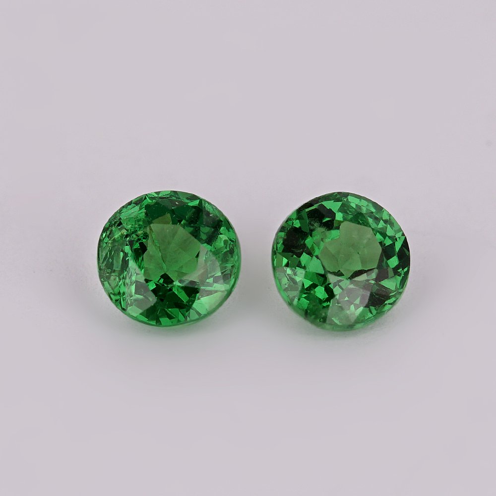 0.69 ct. Tsavorite Garnet Pair - KENYA, EAST-AFRICA: 0.69 ct. Tsavorite Garnet Pair - KENYA, EAST-AFRICA Color - Vivid Green Clarity - VVS Cut - Round Ct. Weight - 0.69 ct. No. of Tsavorite Garnets - 2 Origin -