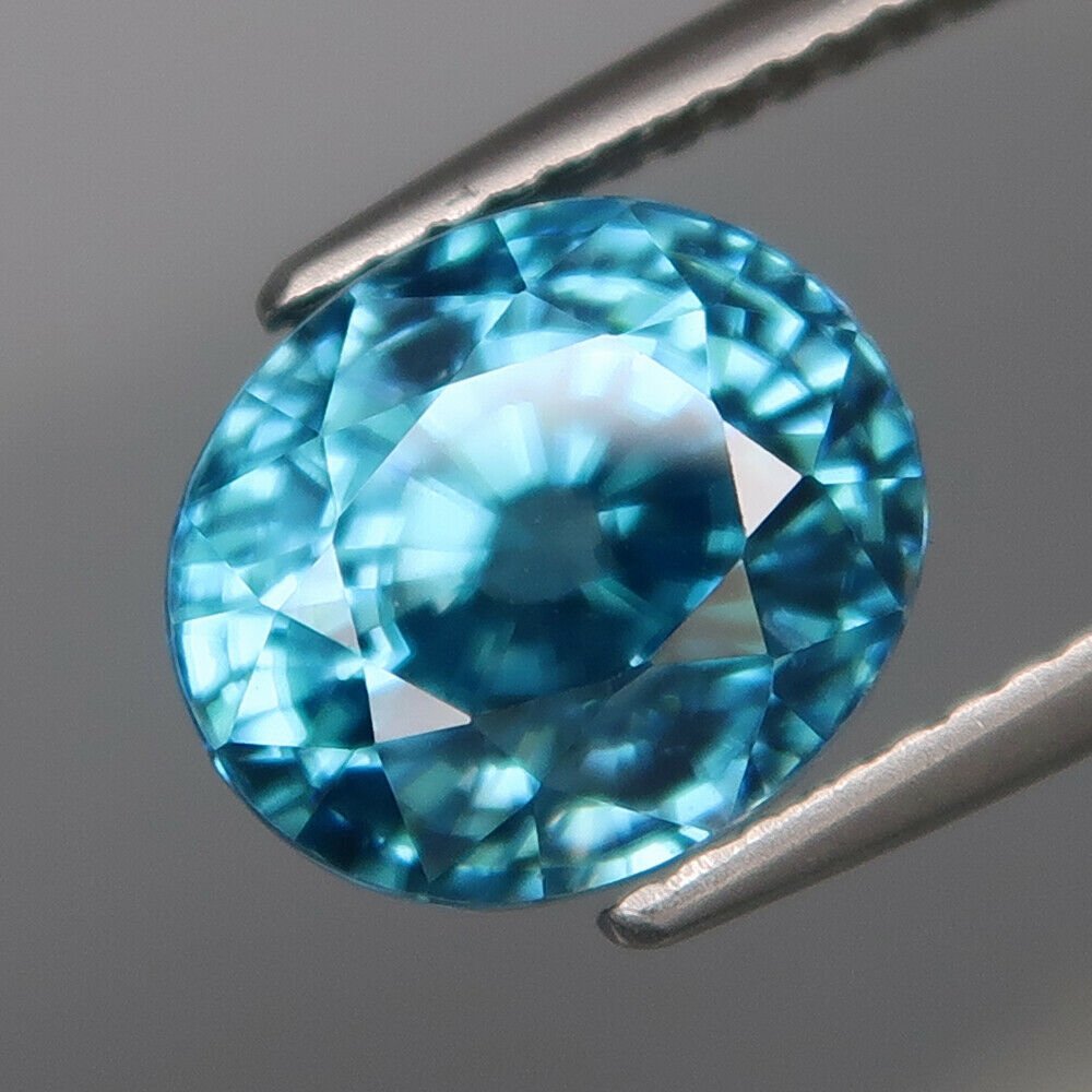 IGI Certified 6.87 ct. Natural Blue Zircon - CAMBODIA: IGI Certified 6.87 ct. Natural Blue Zircon - CAMBODIA Color - Blue Clarity - VVS Cut - Oval Mixed Cut Ct. Weight - 6.87 ct. Dimensions - 9.89 x 8.40 x 7.72 mm <