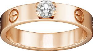 18 K Rose Gold CARTIER Style Solitaire Diamond Ring: RESERVE PRICE - 1500 EURO 18 K / 750 Rose Gold CARTIER Style Solitaire Diamond Ring 18 K / 750 Hallmarked Rose Gold Gross Gold weight - 6.300 g Ring size - US 7 Total ct.