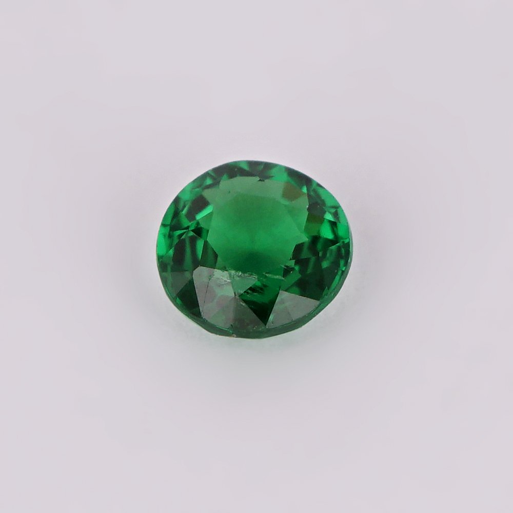 0.23 ct. Tsavorite Garnet - KENYA, EAST-AFRICA: RESERVE PRICE - 100 € 0.23 ct. Tsavorite Garnet - KENYA, EAST-AFRICA Color - Vivid Green Clarity - VVS Cut - Round Ct. Weight - 0.23 ct. Origin -