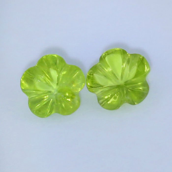 IGI Cert. 2.03ct. Set of 2 Flower Cut Peridots PAKISTAN: IGI Certified Set of 2 - 1.10 + 0.93 = 2.03 ct. Yellowish Green Peridot - PAKISTAN Cut - Flower cut Color - Yellowish Green Clarity - VS - SI Ct. Weight - 1.10 + 0.93 = 2.03 ct. Dimensi