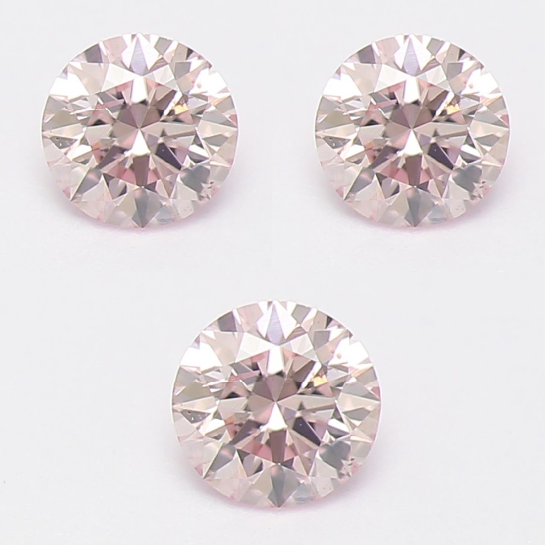 0.06 ct. Set of 3 Light Pink Diamond Lot - I UNTREATED: Set of 3 - 0.06 ct. Light Pink Diamond Lot - I - UNTREATED Cut - Round Brilliant Color - Light Pink Clarity - I Ct. Weight - 0.02 x 3 = 0.06 ct. Number of diamonds - 3 Treatment