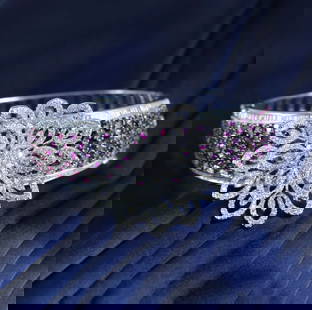 14 K White Gold Designer Bracelet With Diamonds & Rubies: IGI Certified 14 K / 585 White Gold Designer Bracelet with Diamonds and Rubies Bracelet with side hinges and tongue lock Extra side lock for security Hand crafted Gross gold weight - 41.680 g