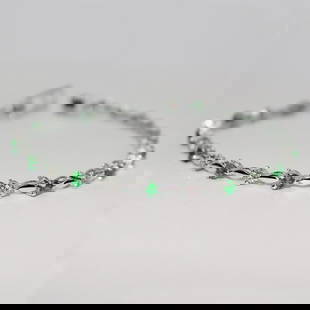 IGI Certified 14 K / 585 White Gold Diamond & Tsavorite Garnet Tennis Bracelet: IGI Certified 14 K / 585 White Gold Diamond &amp; Tsavorite Garnet Tennis Bracelet &nbsp; Hand crafted Gross gold weight - 7.000 g 14 K solid Hallmarked White gold Bracelet length - 7 inches &nb