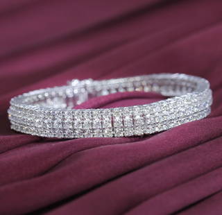 14 K / 585 White Gold 3 Line Diamond Tennis Bracelet: 14 K / 585 White Gold 3 Line Tennis Bracelet with 12.30 ct. Diamonds  3 line Diamond Tennis Bracelet with Diamonds Bracelet with side hinges and tongue lock Extra side lock for security Hand crafted