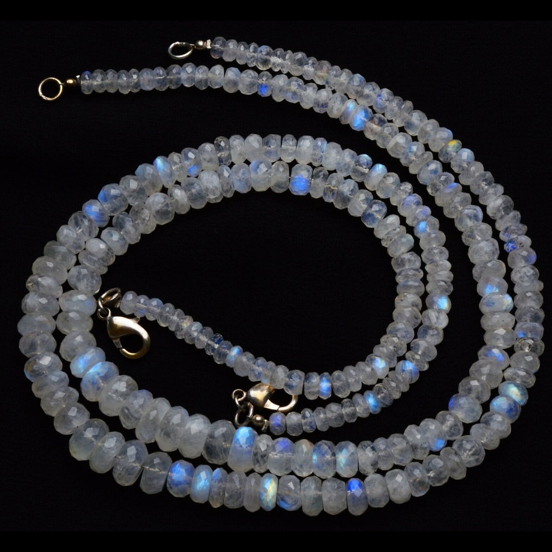 182.00 ct. Natural Moonstone Rondelle Beads Necklace: 182.00 ct. Natural Blue Fire Moonstone Rondelle Beads Single strand Necklace Color - White Shape - Faceted Rondelle beads Gem Weight - 182.00 ct. Size - 5 to 10 mm Approx. With sterling silve