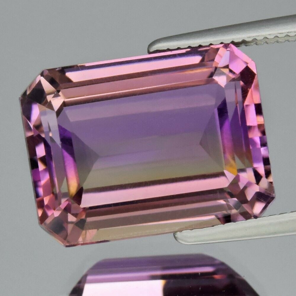 8.16 ct. Natural Purple and Yellow Ametrine - BOLIVIA: 8.16 ct. Natural Purple and Yellow Ametrine - BOLIVIA Ct. Weight - 8.16 ct. Color - Purple and Yellow Clarity - IF Cut - Octagon Dimensions - 13.50 x 10.00 x 7.30 mm Origin -