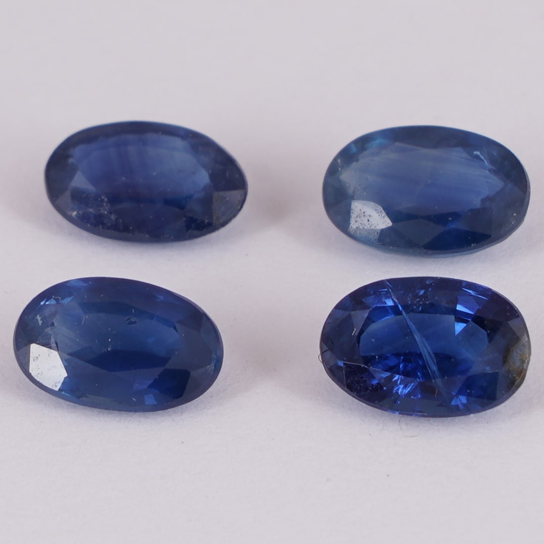 IGI Cert. 2.17 ct. Set of 4 Blue Sapphires MADAGASCAR: IGI Certified 2.17 ct. Set of 4 Blue Sapphires - MADAGASCAR Color - Blue Cut - Oval Mixed cut Clarity - SI Ct. Weight - 0.52 + 0.60 + 0.59 + 0.46 = 2.17 ct. Dimensions - 6.07 x 3.92 x 2.47 mm