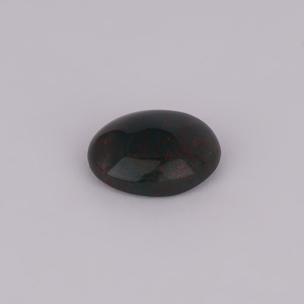 5.76 ct. Bloodstone - AFRICA: 5.76 ct. Bloodstone - AFRICA Color - Black Clarity - Translucent Cut - Cabochon Ct. Weight - 5.76 ct. Origin - AFRICA Treatment - None