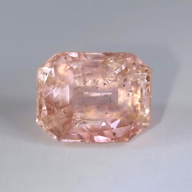 GRS 5.90 ct. Padparadscha Sapphire - SRI LANKA: GRS Certified 5.90 ct. Padparadscha Sapphire - SRI LANKA Ct. Wt. - 5.90 ct. Color - Pinkish Orange Clarity - Transparent Cut - Octagonal Step Cut Clarity - SI Dimensions - 9.99 x 7.74 x