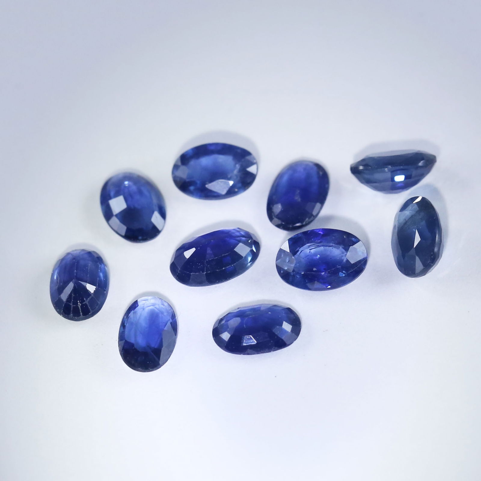 5.15 ct. Blue Sapphire Lot - MADAGASCAR: 5.15 ct. Blue Sapphire Lot - MADAGASCAR Color - Blue Cut - Oval Mixed Cut Ct. Wt. - 5.15 ct. Clarity - VS - SI Dimensions - Mix sizes No. of Sapphires - 10 Origin