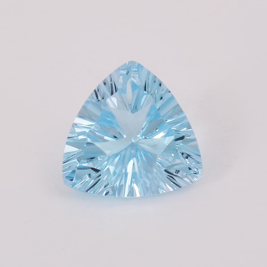 GFCO (SWISS) Certified 6.11 ct. Blue Topaz - BRAZIL: GFCO (SWISS) Certified 6.11 ct. Blue Topaz - BRAZIL Cut - Trillion Fancy Cut Color - Blue Ct. Weight - 6.11 ct. Clarity - VVS Dimensions - 12.1 X 12.9 X 6.61 mm