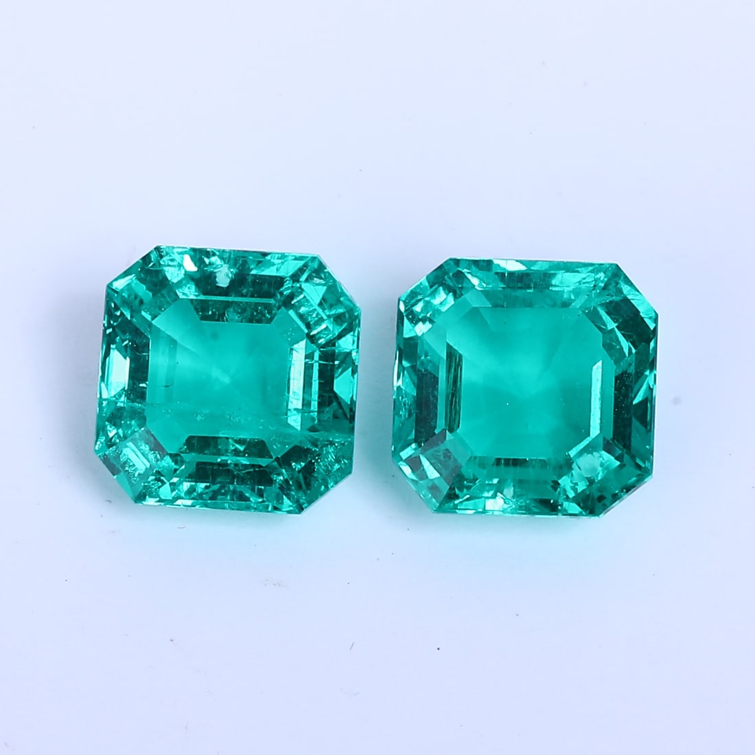 14.72 ct. Pair of Emeralds - COLOMBIA: 14.72 ct. Pair of Emeralds - COLOMBIA Ct. Wt. - 14.72 ct. Color- Green Cut - Cut-cornered Cushion cut Clarity - VS Origin - COLOMBIA Treatment - Minor Oi