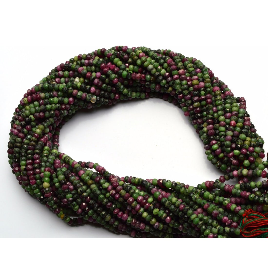 37.90ct. Ruby Zoisite Rondelle Bead Strand for Necklace: 37.90 ct. Ruby Zoisite Micro Facet Rondelle Bead Single Strand for Necklaces Color - Green-Red Shape - Rondelle Beads Size - 3.5 mm Approx. Gem Weight - 37.90 ct. No. of strands - 1
