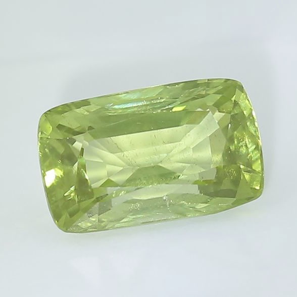 IGI Certified 3.16 ct. Yellowish Green Peridot PAKISTAN: IGI certified 3.16 ct. Yellowish Green Peridot - PAKISTAN Weight - 3.16 ct. Color - Yellowish Green Clarity - VS Cut - Rectangular Cushion Mixed Cut Dimensions - 10.47 x 6.54 x 5.22 mm