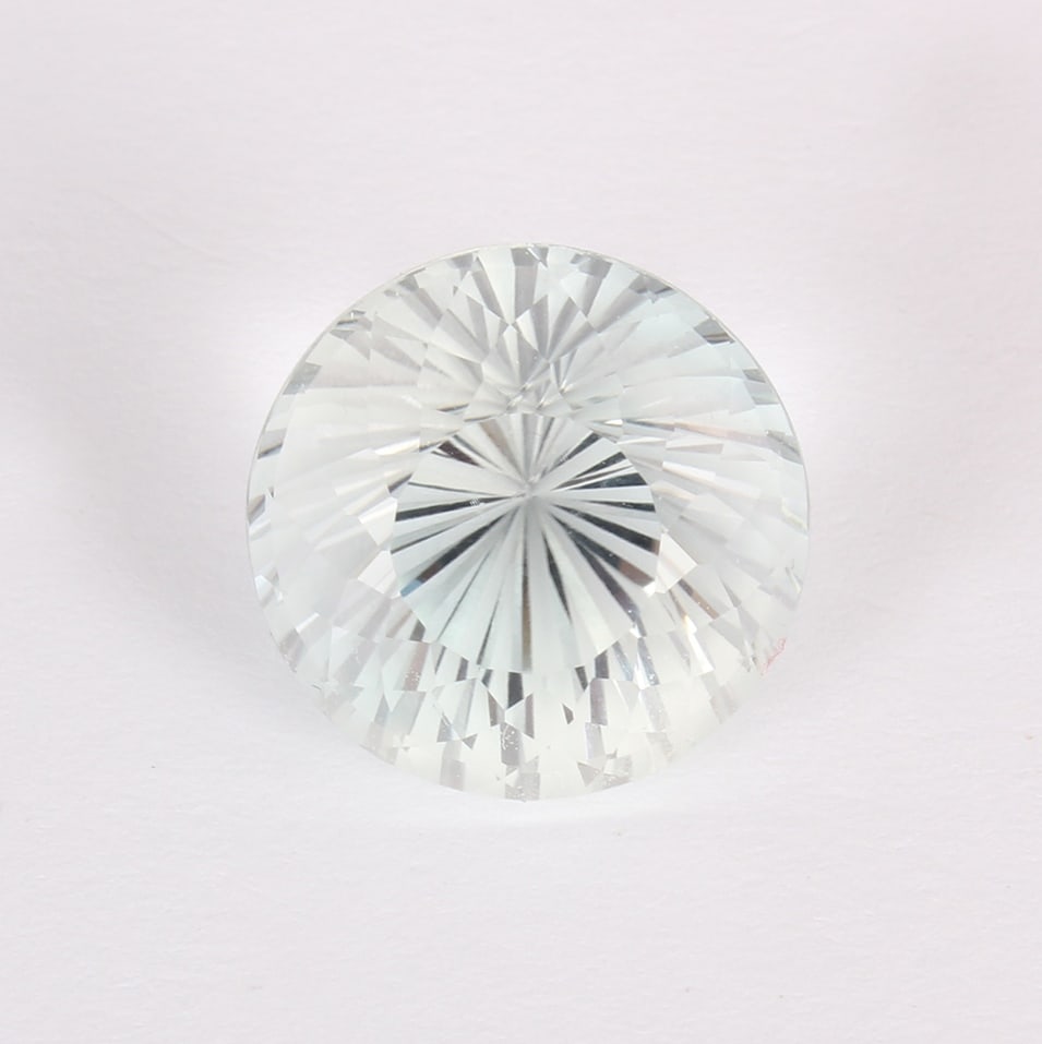 GFCO (Swiss) Certified 21.04 ct. White Topaz - BRAZIL: GFCO (Swiss) Certified 21.04 ct. White Topaz - BRAZIL Color - White Cut - Round Brilliant Modified cut Ct. Wt. - 21.04 ct. Clarity - VVS Dimensions - 16.3 x 16.21 x 12.62 mm Orig