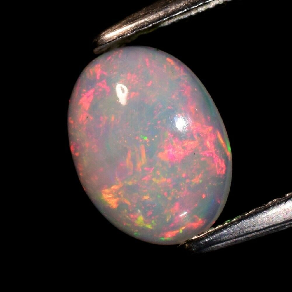0.97 ct. Natural Play of Color White Opal - ETHIOPIA (1 of 2)