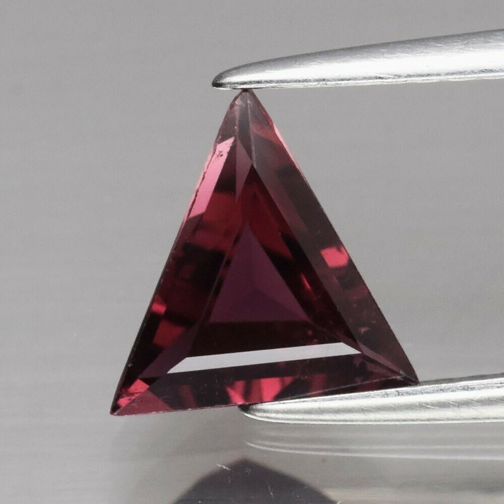 0.90 ct. Natural Rubellite Tourmaline - MOZAMBIQUE: 0.90 ct. Natural Rubellite Tourmaline - MOZAMBIQUE Shape - TrillionColor - Pinkish PurpleClarity - VSCt. Weight - 0.90 ct.Dimensions - 8.00 x 8.00 x 3.10 mm Origin - MOZAMBIQUE, AFRICA Treatment -
