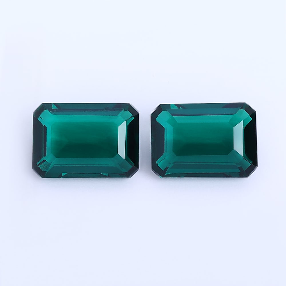 11.96 ct. Pair of Vivid Green Emeralds - COLOMBIA: 11.96 ct. Pair of Vivid Green Emeralds - COLOMBIA Ct. Wt. - 11.96 ct. Color - Vivid Green Cut - Emerald cut Clarity - VS No. of Emeralds - 2 Origin - COLOMBIA