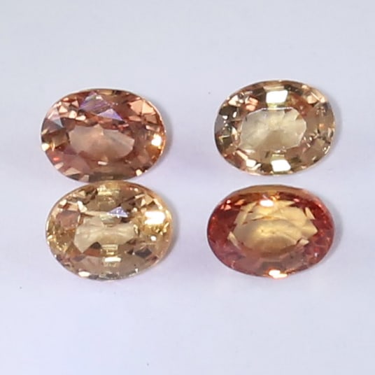 IGI Certificate 0.90 ct. Set of 4 Padparadscha Sapphires: IGI Certified 0.90 ct. Set of 4 Padparadscha Sapphires - MADAGASCAR Color - Pinkish OrangeCut - Oval Mixed cutClarity - SICt. Weight - 0.23 + 0.27 + 0.18 + 0.22 = 0.90 ct.Dimensions - 3.96 x 3.15 x