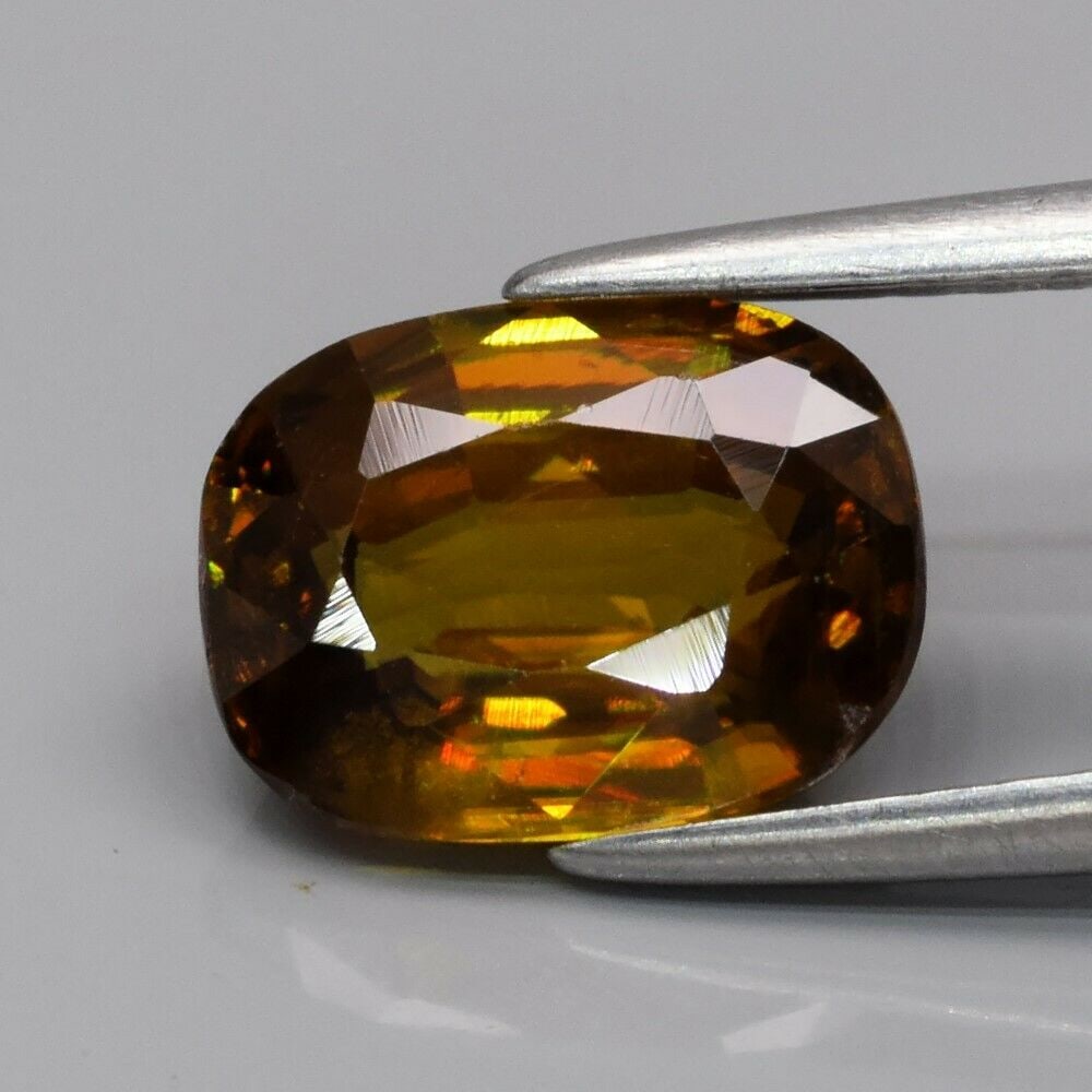 2.15 ct. Natural Greenish Yellow Sphene - MADAGASCAR, AFRICA: 2.15 ct. Natural Greenish Yellow Sphene - MADAGASCAR, AFRICA Color - Greenish Yellow With Rainbow SparkCut - CushionClarity - SI1Ct. wt. - 2.15 ct.Dimensions - 8.70 x 6.50 x 4.20 mm Origin -