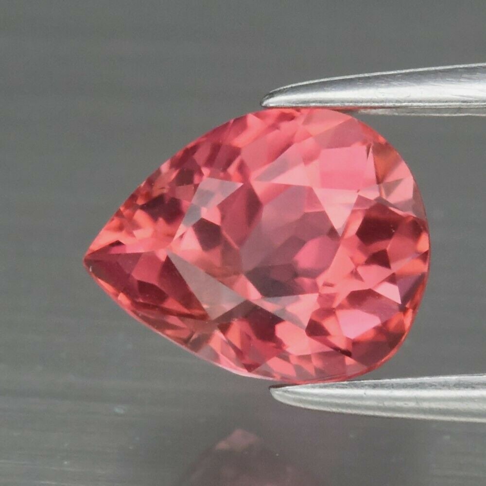1.30 ct. Unheated Pinkish Orange Tourmaline -MOZAMBIQUE: 1.30 ct. Natural Unheated Pinkish Orange Tourmaline - MOZAMBIQUE Shape - Pear Color - Pinkish Orange Clarity - VS Ct. Weight - 1.30 ct. Dimensions - 7.50 x 6.00 x 5.00 mm