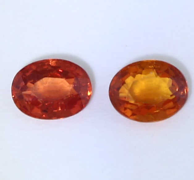 IGI Certificate 0.45 ct. Set of 2 Padparadscha Sapphires: IGI certified 0.45 ct. Set of 2 Padparadscha Sapphires - MADAGASCAR Color - Pinkish Orange and Pink Orange Clarity - VS Cut - Oval Mixed Cut Weight - 0.22 + 0.23 = 0.45 ct. Dimensions - 3.98 x