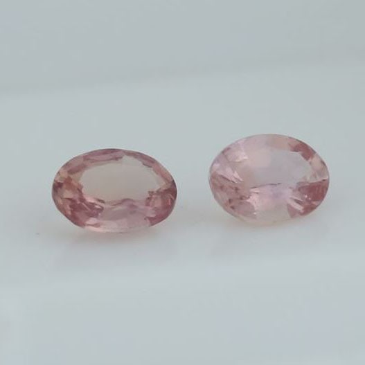Set of 2 - IGI Cert. Padparadscha Sapphires MADAGASCAR: IGI Certified 0.75 ct. Set of 2 Padparadscha Sapphires - MADAGASCAR Cut - Oval Mixed cut Color - Pinkish Orange Clarity - VS-SI Ct. wt.- 0.38 + 0.37 = 0.75 ct. Dimensions - 5.03 X 3.83 X 2.35