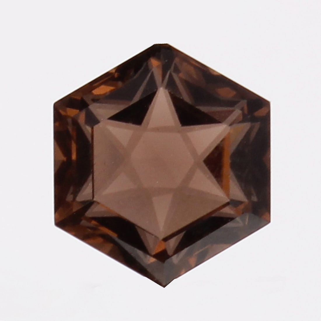GFCO (SWISS) Certified 6.57 ct. Brown Smoky Quartz: GFCO (SWISS) Certified 6.57 ct. Brown Smoky Quartz Cut - Hexagon Fancy Step Cut Color - Brown Ct. Weight - 6.57 ct. Clarity - VVS Dimensions - 12.85 X 11.15 X 7.7 mm GFC