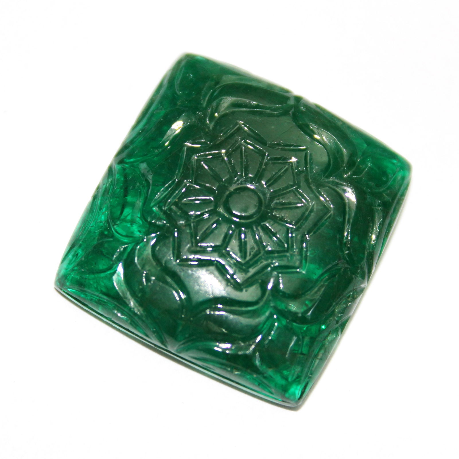 58.95 ct. Natural Emerald Carving - ZAMBIA: 58.95 ct. Natural Emerald Carving - ZAMBIA Shape - Square Color - Green Ct. Weight - 58.95 ct. Dimensions - 25 mm x 25 mm Origin - ZAMBIA